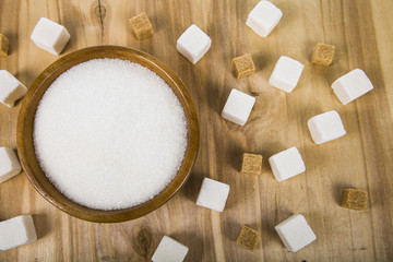 Sugar in a wooden bowl