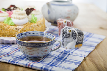 Cake with cream and tea