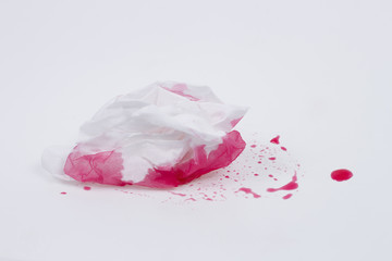White tissue cleans red dew