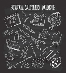 School supplies doodle on chalkboard