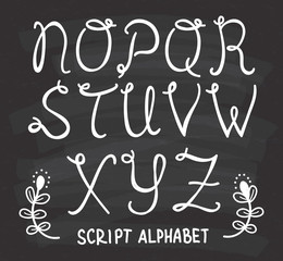 script alphabet on chalkboard background