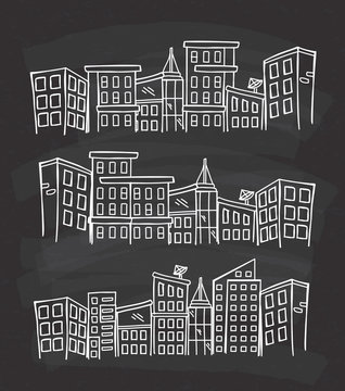 City skylines in cartoon doodle style on chalkboard background