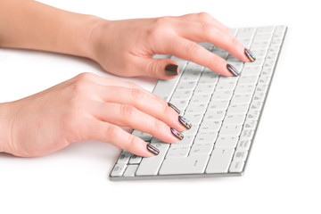 Hands of an office woman typing