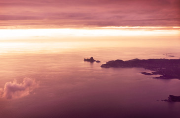 Naklejka premium View over the south west of Ibiza Island with the magic rock of es Vedra in sunset.