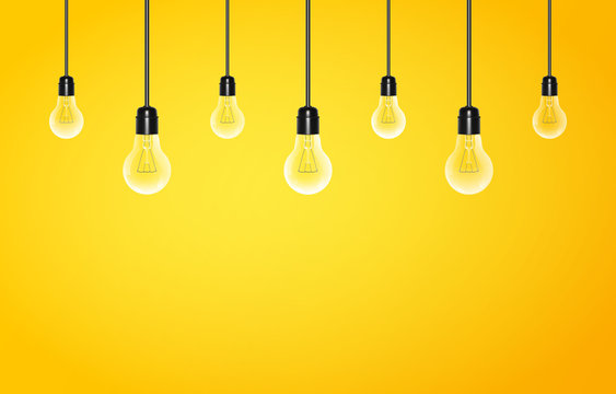 Hanging light bulbs on a yellow background with copy space. Vector illustration for your design.