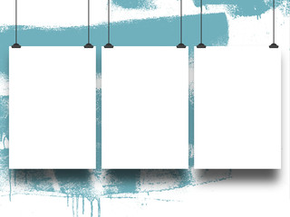 Close-up of three hanged paper sheets with clips on blue paint brush stroke over white background