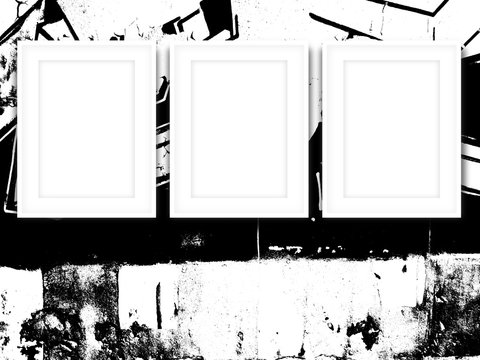 Close-up of three white picture frames on black and white ink splotchy background