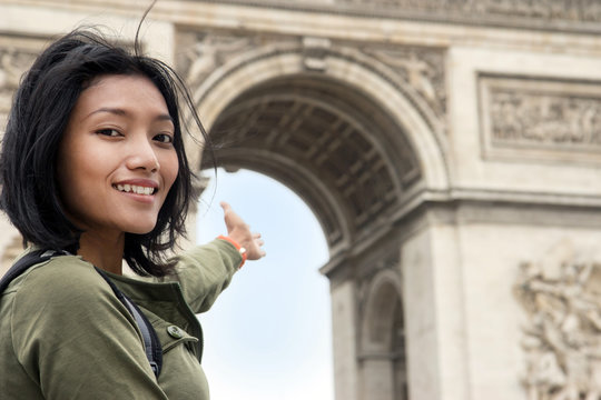 Woman Pointing At The Triumphal Arch - Arc De Triomphe