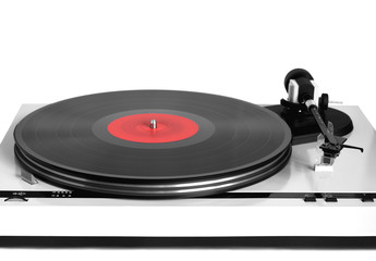 Modern turntable in silver case with rotation vinyl record with red label isolated on white background. Horizontal photo front view closeup