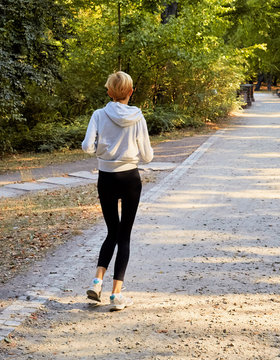 Anorexic woman running in park