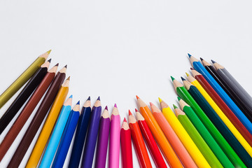 Colored pencils on white background