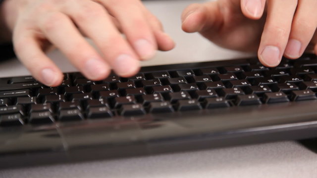 Man typing on keyboard