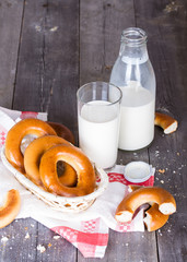 Milk and bagels on a wooden table