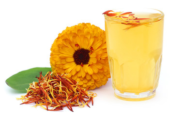 Herbal calendula flower with extract in a glass