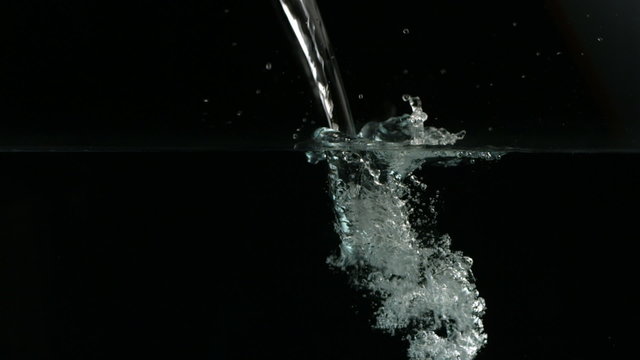 Water pouring and bubbling, slow motion