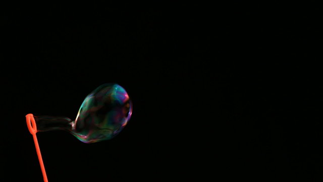 Colorful bubbles over black background