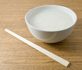 Soft Boiled Rice or Rice Porridge with Chopsticks © arayabandit
