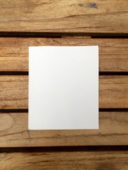 note paper in a wood background