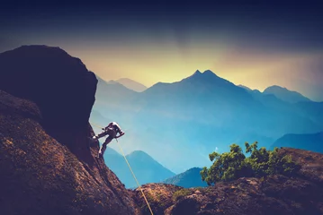 Wandcirkels aluminium Climber in a high mountains © Bashkatov