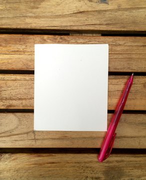 note paper in a wood background
