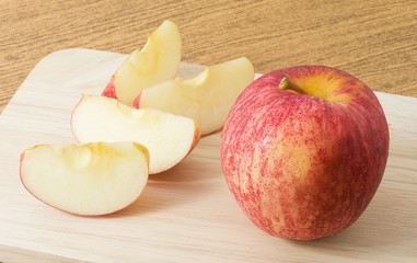 Fresh Ripe Red Apple on Wooden Tray