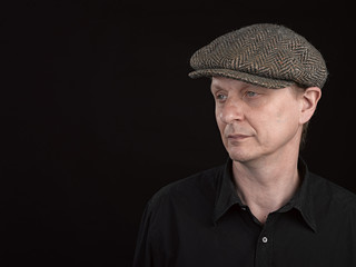 Male model wearing a patterned side hat