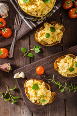 Scrambled eggs with herbs and garlic on toasted bread