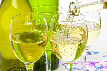 White Wine Pouring into Glasses