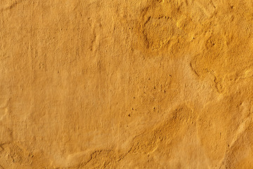 Yellow stucco wall. Background texture
