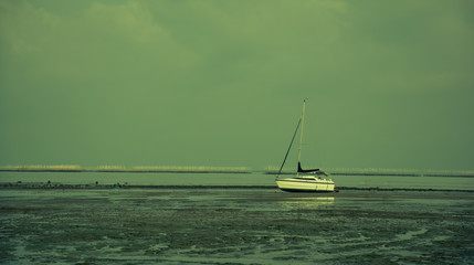 Fototapeta premium Boat in sunset, color effect