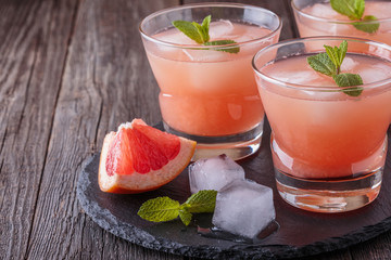 Grapefruit cocktail with ice and mint.