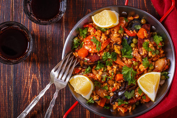 Paella with chicken, chorizo, seafood, vegetables and saffron se