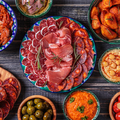 Typical spanish tapas concept, rustic style,  top view.