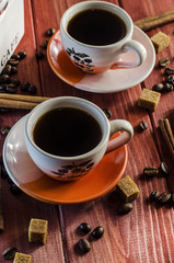 brewed coffee and coffee beans with cinnamon