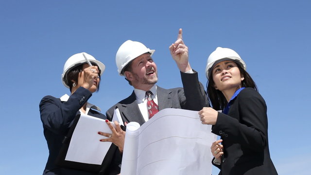 Businesspeople look at construction site