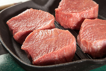 Above view of raw fresh marbled meat steaks, studio shot, closeup