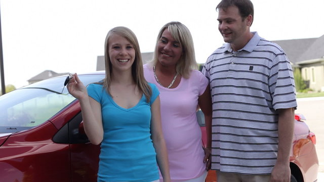 Teenage driver with her parents