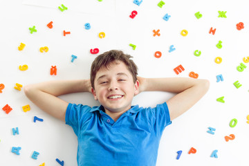 smiling boy lying on floor