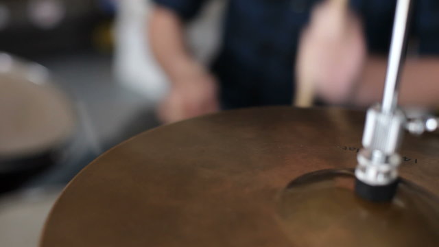 Closeup of man playing drums
