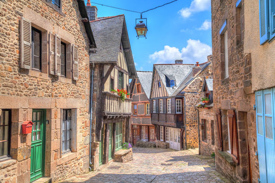 Narrow street with old traditional houses in Dinan