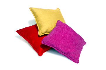 Silk pillows and pillows cases on white background