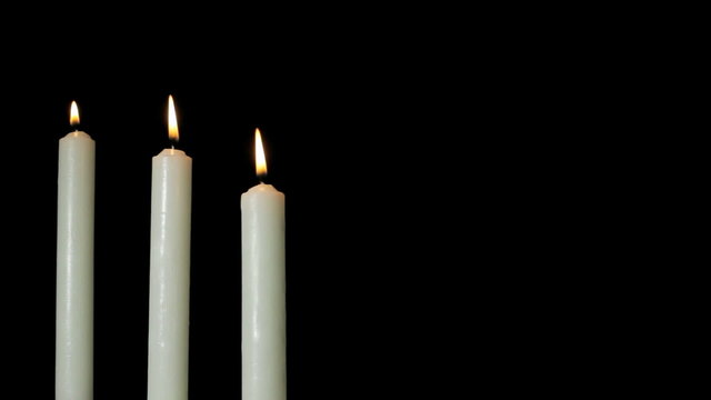 Ceremonial candles on black background 1080 