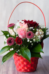 beautiful bouquet in basket on the table