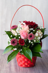 beautiful bouquet in basket on the table