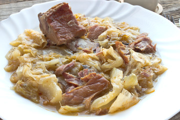 Sauerkraut with smoked pork in plate