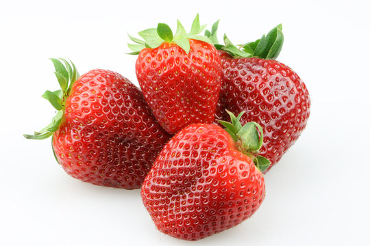 Vier dekorative Erdbeeren