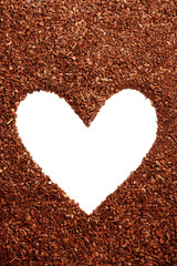 Pine bark mulch surrounding white heart symbol