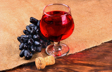 Black grapes and wine
