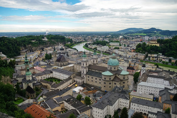 Fototapeta na wymiar Aerial view of the historic city of Salzburg at fog and cloudy weather, Salzburgerland, Austria