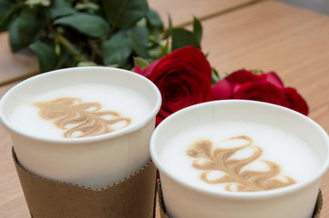 Two cups of coffee and roses